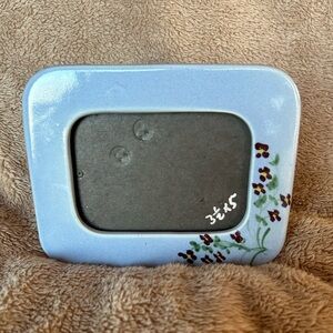 Beautiful little ceramic picture frame with delicate violets